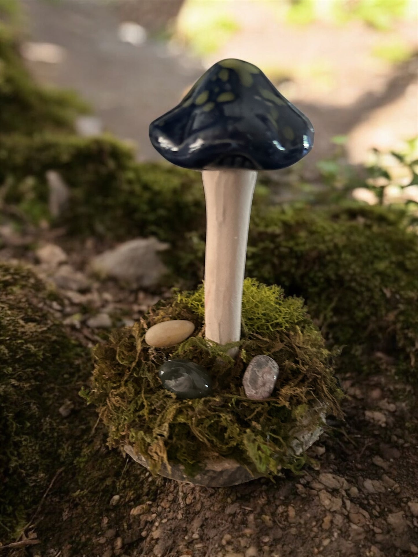 Whimsical blue and green mushroom with moss and gemstones