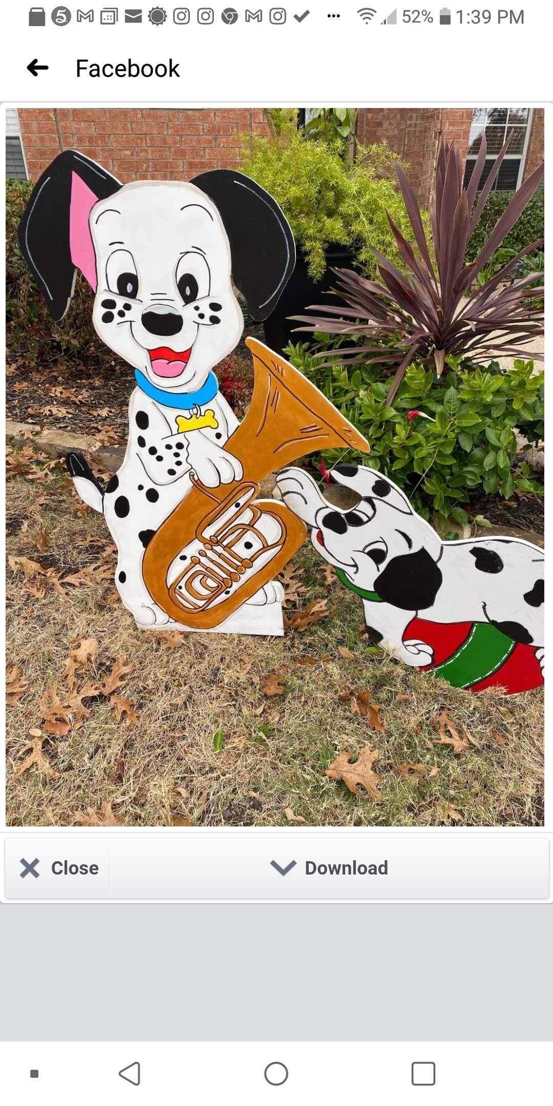 101 Dalmatian puppy with a tuba Christmas display