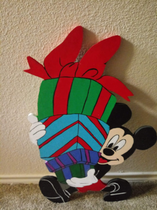 Mickey Mouse carrying Christmas presents