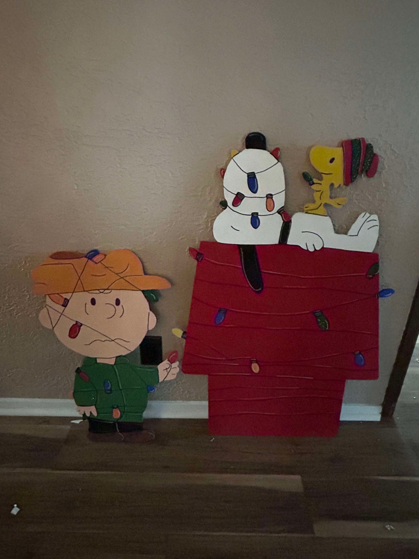 Handmade Charlie Brown Snoopy and Woodstock tangled in lights Christmas Yard Art