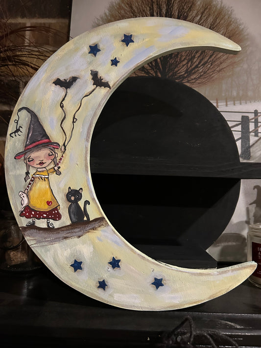 There’s a little witch and all of us crescent moon wall shelf
