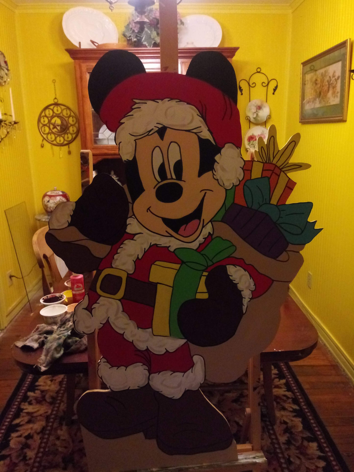 Mickey Mouse Santa carrying his pack of toys