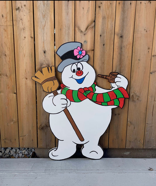 Frosty the snowman with his broom and pipe